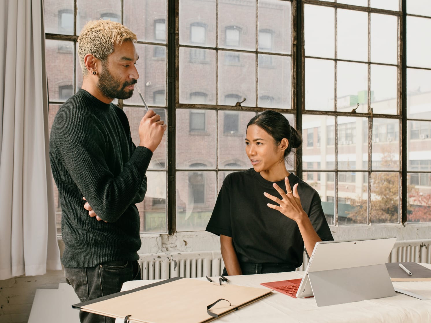 Two colleagues collaborating in an office
